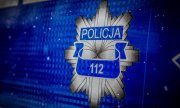 gwiazda policyjna i napis: Policja oraz 112