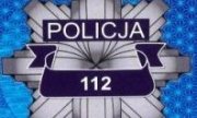 fragment gwiazdy policyjnej z widocznym napisem Policja i nr 112