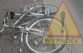 leżący rower i trójkąt ostrzegawczy a pod spodem napis: WYPADEK