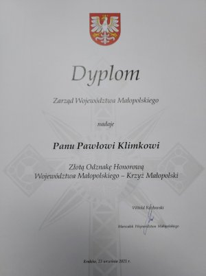 Dyplom nadania przez Zarząd Województwa Małopolskiego Odznaki Honorowej Złotowego Krzyża Małopolski