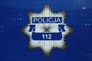 Granatowe tło a na nim policyjna gwiazda, na niej napis Policja i numer 112.