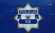Numer alarmowy 112 na tle odznaki policyjnej