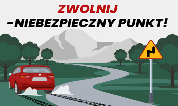 Samochód wypadający z drogi na zakręcie i napis Zwolnij - Niebezpieczny punkt!