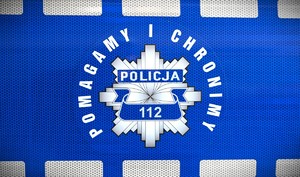 Policyjna gwiazda z napisem pomagamy i chronimy.