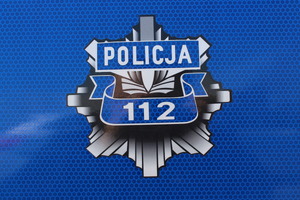 Grafika prezentująca gwiazdę policyjną z numerem 112.