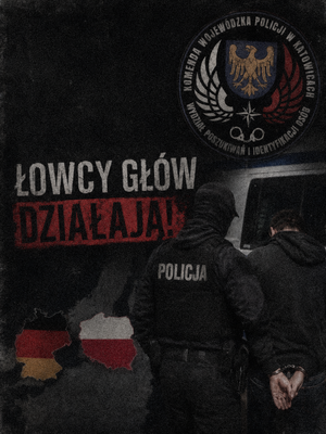 ciemne zdjęcie. policjant stoi plecami do aparatu.